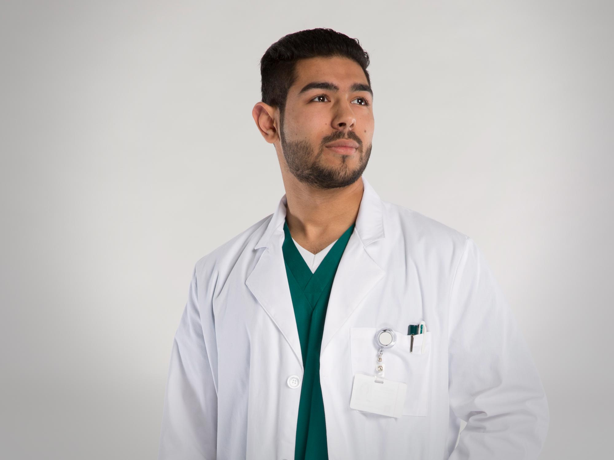 Male student in white medical lab coat